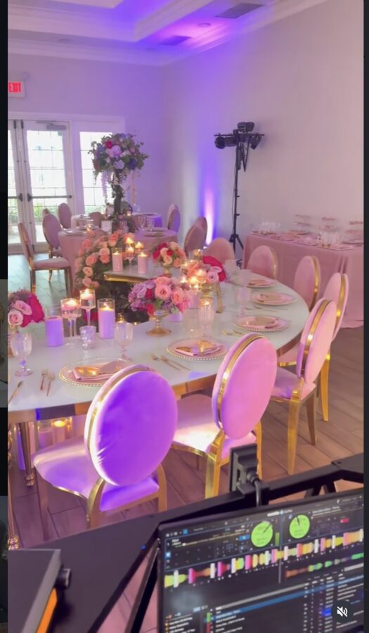 Elegant reception tablescape with warm uplighting produced by Hyvyb Productions