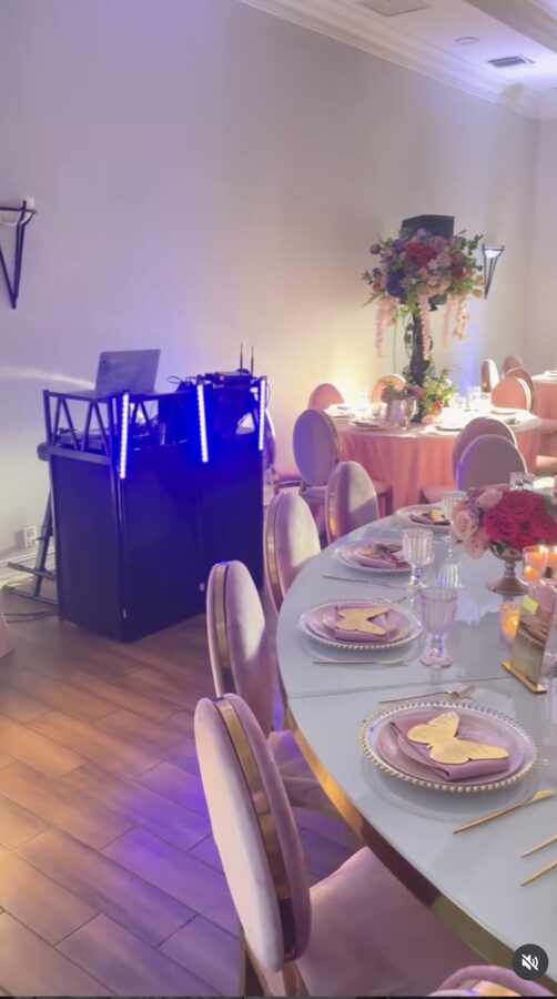 DJ setup in an elegant blue-lit event room