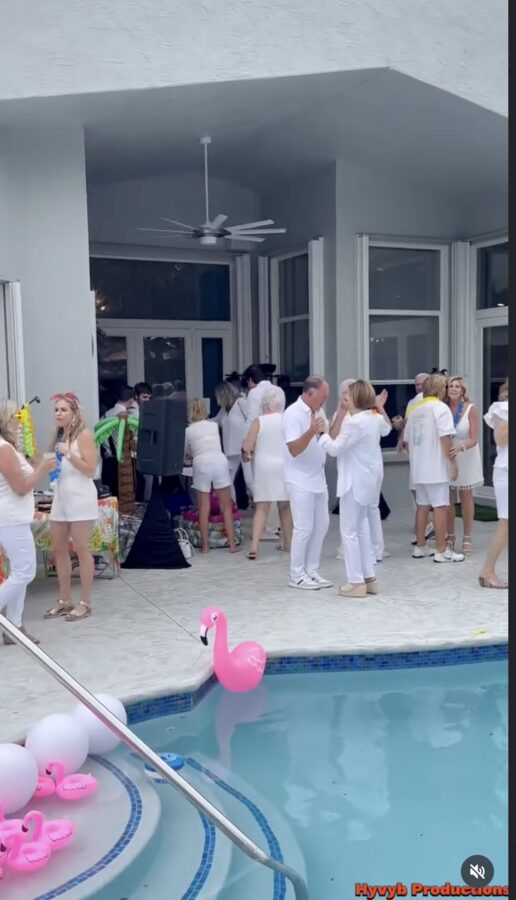Guests dancing at a white-party celebration